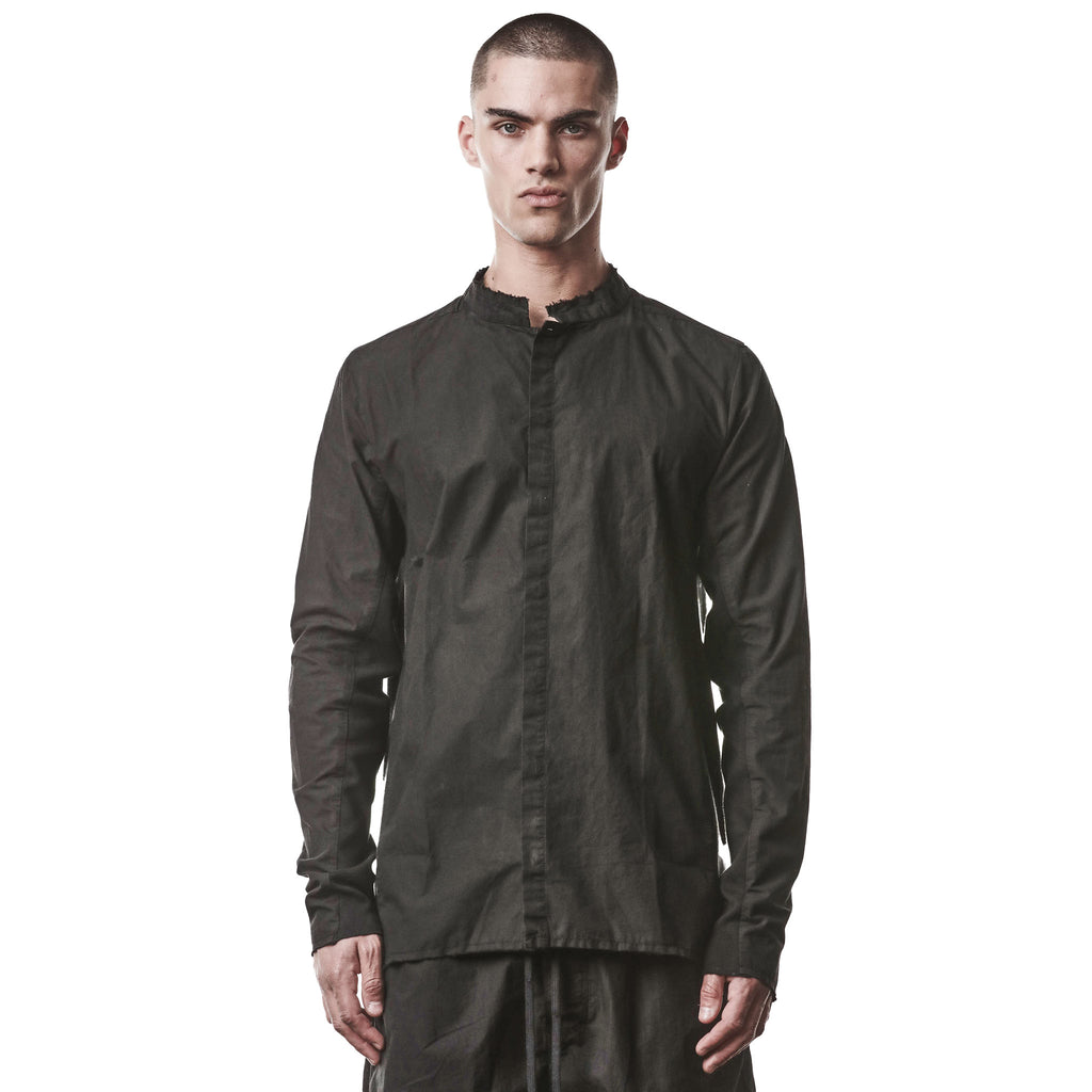 Man wearing a black, unique button up shirt on a white background